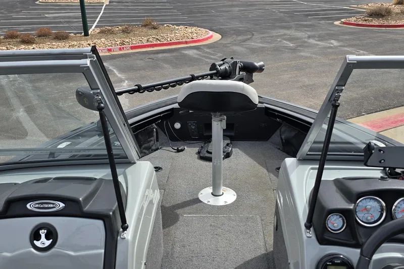 Slide: The Image of 2019 Tracker Targa V-19 WT Tournament Edition boat interior with steering console and seating. - 2