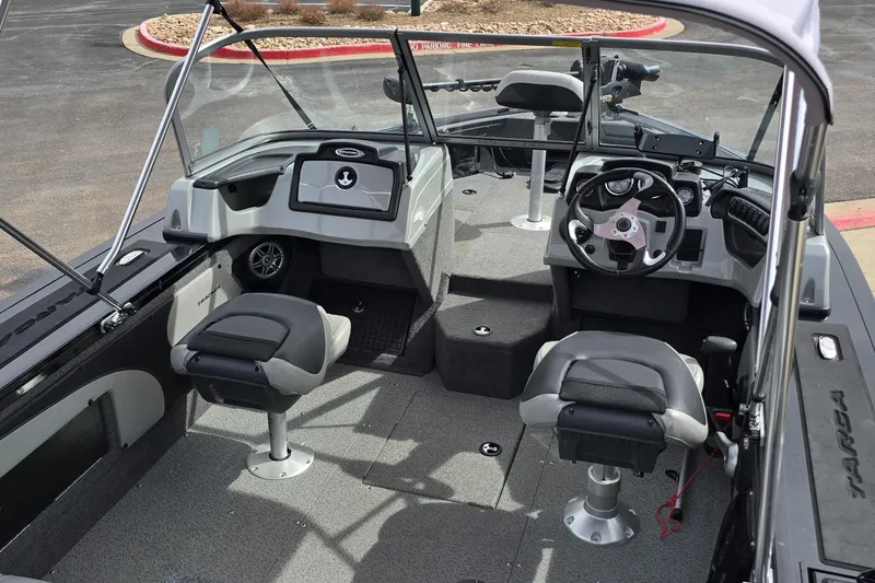 Slide: The Image of 2019 Tracker Targa V-19 WT Tournament Edition boat interior with seating and steering console. - 3