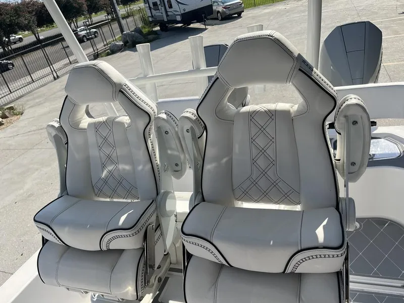 Slide: The Image of 2023 Sea Cat 262 Ultimate Edition boat storage compartments with life jackets and gear. - 11