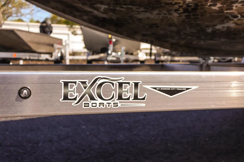 Slide: The Image of 2025 Excel 1751 F4 Shallow Water boat trailer detail, featuring Excel Boats logo. - 10