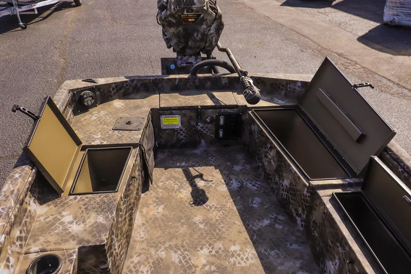 Slide: The Image of 2025 Excel 1751 F4 Shallow Water boat interior with open storage compartments. - 17