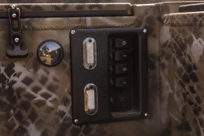 Slide: The Image of Control panel of 2025 Excel 1751 F4 Shallow Water boat with camouflage design. - 19