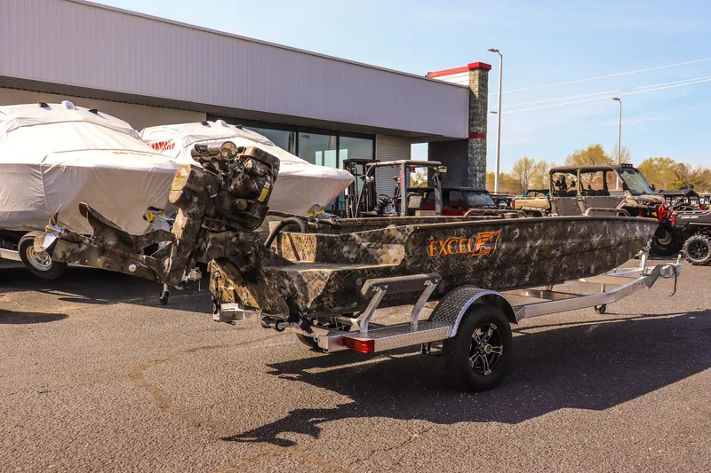 Slide: The Image of 2025 Excel 1751 F4 Shallow Water boat on trailer, parked outdoors. - 5