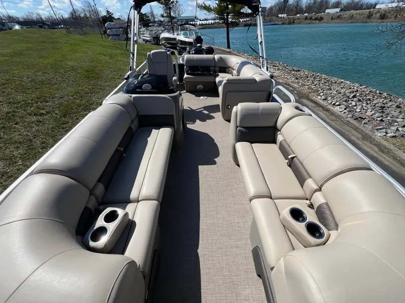 Slide: The Image of 2023 Sun Tracker Party Barge 20 DLX pontoon boat with spacious seating and cup holders. - 11