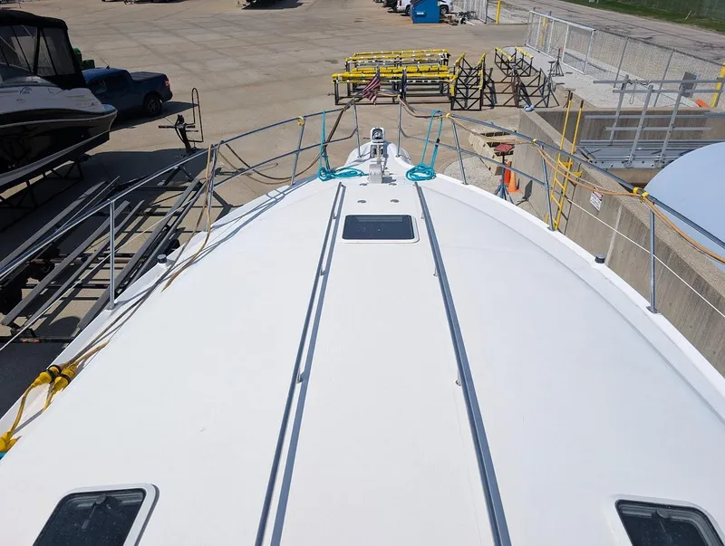 Slide: The Image of 1995 Sea Ray 400 Express Cruiser on dry dock, viewed from the bow. - 10