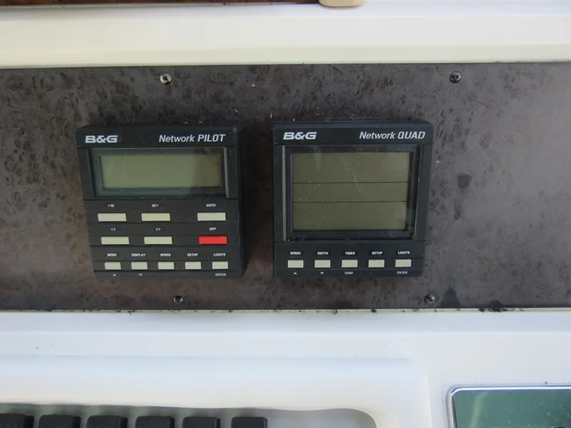 Slide: The Image of B&G Network Pilot and Quad displays on 1995 Sea Ray 400 Express Cruiser dashboard. - 24