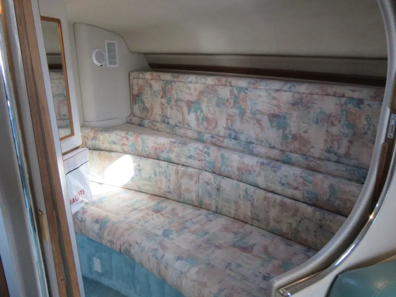 Slide: The Image of Interior of 1995 Sea Ray 400 Express Cruiser with patterned seating. - 34