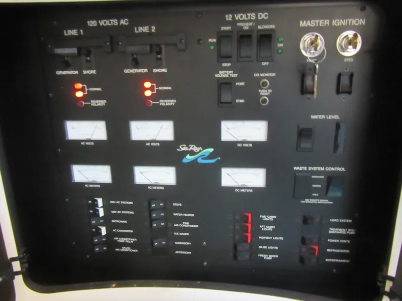 Slide: The Image of Control panel of a 1995 Sea Ray 400 Express Cruiser, featuring electrical and system gauges. - 41
