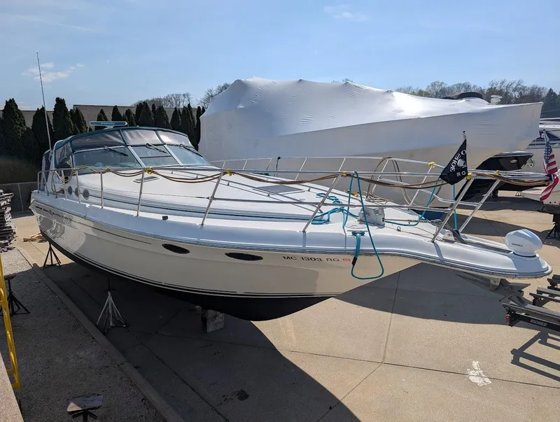 Slide: The Image of 1995 Sea Ray 400 Express Cruiser on dry dock, ready for maintenance. - 9