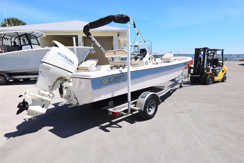 Slide: The Image of 2020 Carolina Skiff 192 JLS boat on trailer with Suzuki outboard motor. - 10