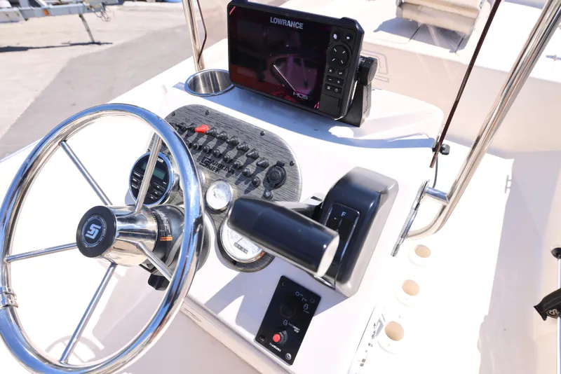 Slide: The Image of 2020 Carolina Skiff 192 JLS boat console with steering wheel and navigation system. - 11
