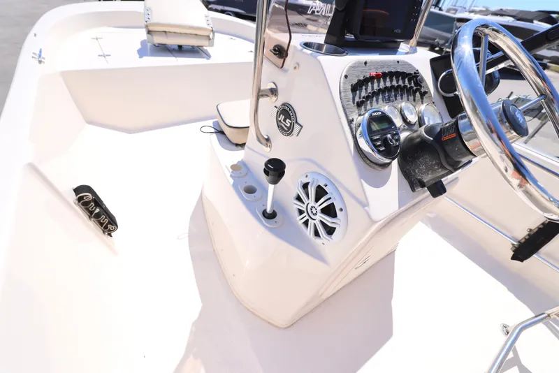 Slide: The Image of 2020 Carolina Skiff 192 JLS boat console with steering wheel and controls. - 14