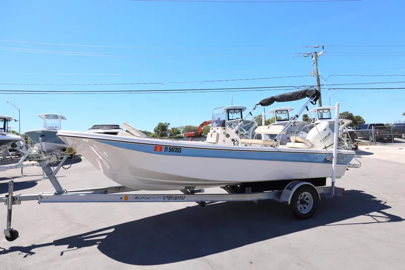 Slide: The Image of 2020 Carolina Skiff 192 JLS boat on trailer in sunny outdoor setting. - 15