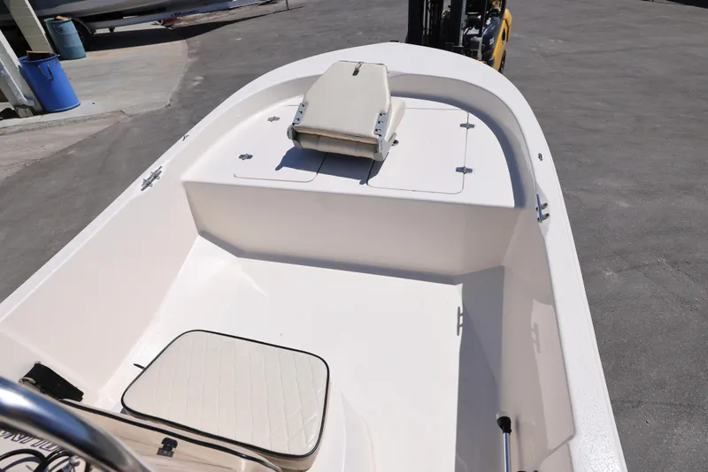 Slide: The Image of 2020 Carolina Skiff 192 JLS boat interior with seating and storage compartments. - 4