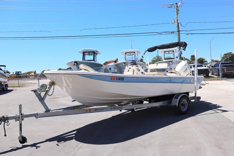 Slide: The Image of 2020 Carolina Skiff 192 JLS boat on trailer in sunny outdoor setting. - 7