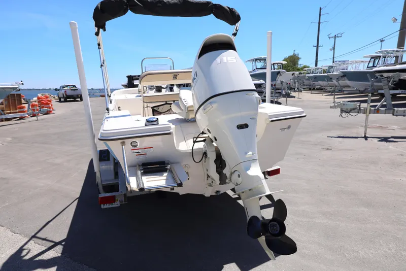 Slide: The Image of 2020 Carolina Skiff 192 JLS boat with outboard motor, parked on a sunny day. - 9