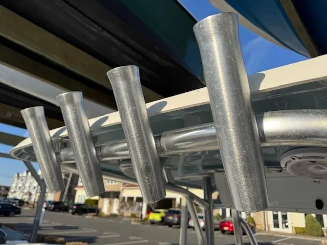 Slide: The Image of Rod holders on a 2022 Sea Hunt Ultra 234 boat, parked in a marina. - 13
