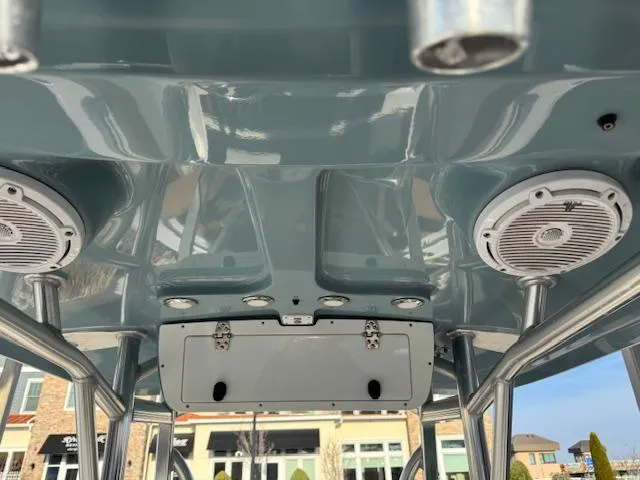 Slide: The Image of 2022 Sea Hunt Ultra 234 boat interior with speakers and metal framework. - 15