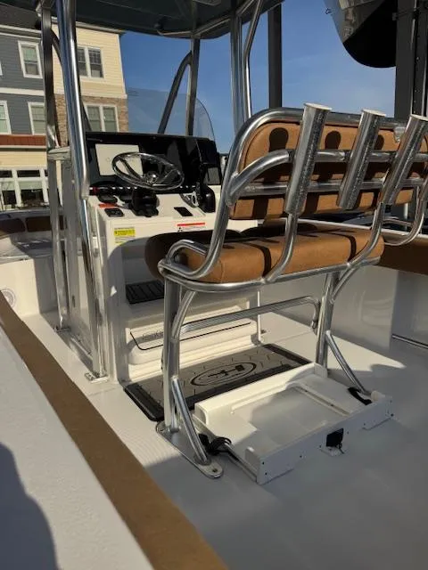 Slide: The Image of 2022 Sea Hunt Ultra 234 boat interior with helm and seating. - 5