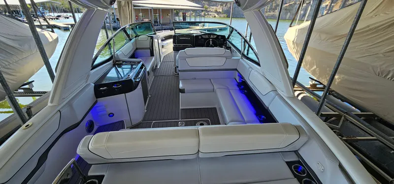 Slide: The Image of 2021 Formula 350 CBR boat interior with luxurious seating and ambient lighting. - 13