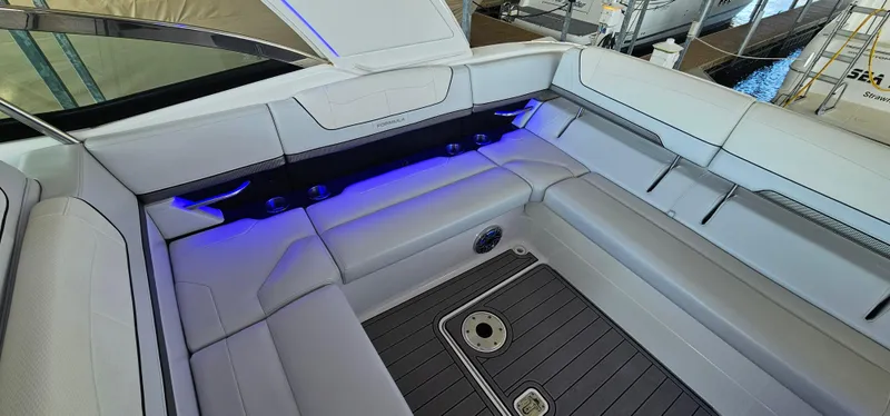 Slide: The Image of 2021 Formula 350 CBR boat interior with sleek seating and ambient blue lighting. - 15
