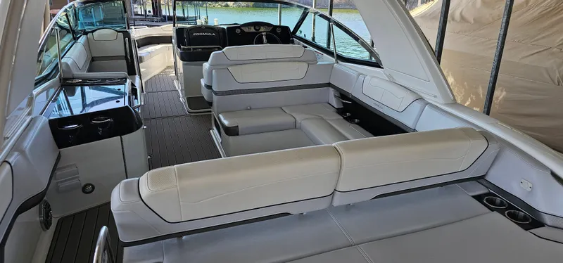 Slide: The Image of 2021 Formula 350 CBR boat interior with luxurious seating and modern design. - 16