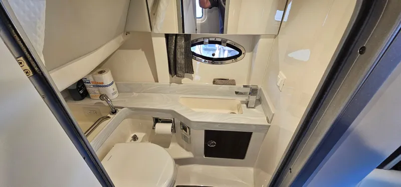 Slide: The Image of 2021 Formula 350 CBR boat bathroom with modern fixtures and compact design. - 21
