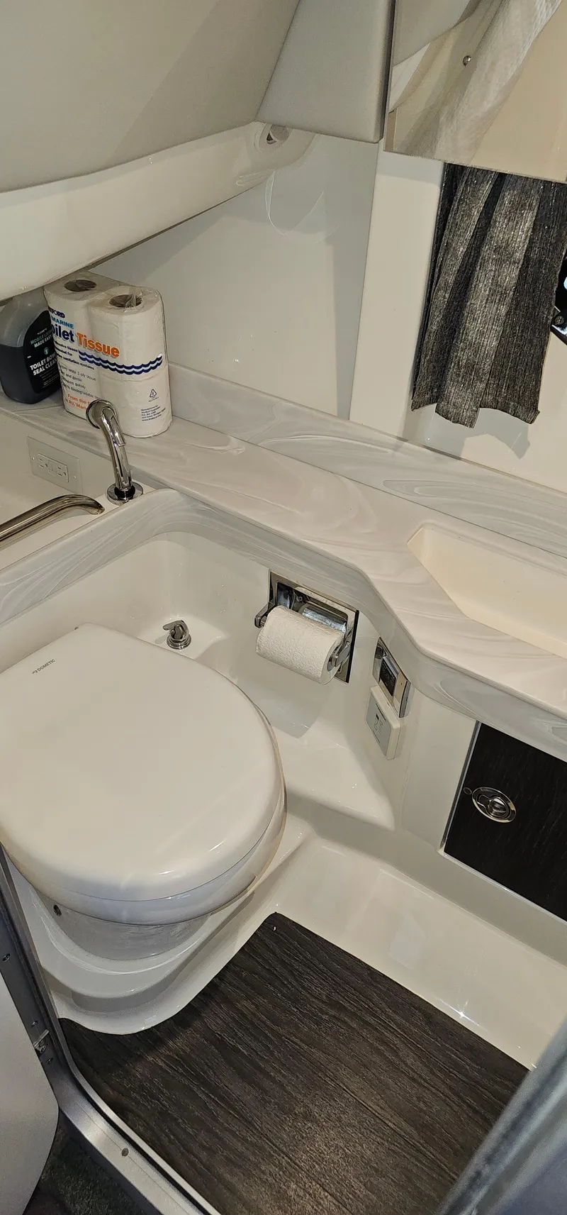 Slide: The Image of 2021 Formula 350 CBR boat bathroom with toilet, sink, and storage. - 26