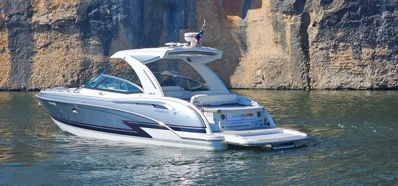 Slide: The Image of 2021 Formula 350 CBR boat cruising near rocky cliffs. - 32