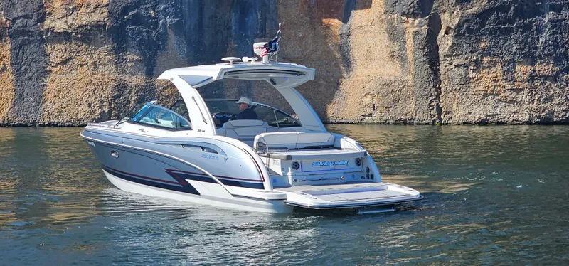 Slide: The Image of 2021 Formula 350 CBR boat cruising near rocky cliffs on a sunny day. - 34