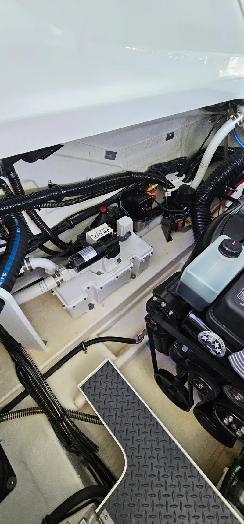 Slide: The Image of Engine compartment of a 2021 Formula 350 CBR boat, showcasing wiring and components. - 36