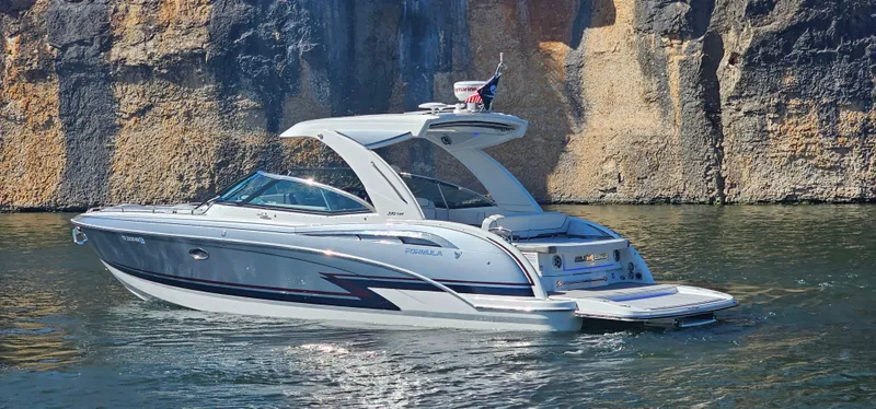 Slide: The Image of 2021 Formula 350 CBR boat cruising near rocky cliffs. - 5