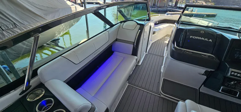 Slide: The Image of 2021 Formula 350 CBR boat interior with sleek seating and ambient lighting. - 9