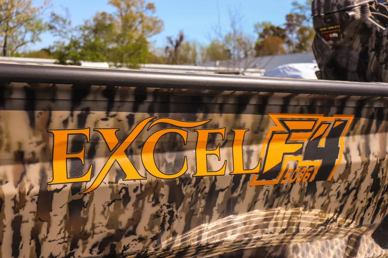 Slide: The Image of 2025 Excel 1754 F4 Shallow Water boat with camouflage design and logo. - 10