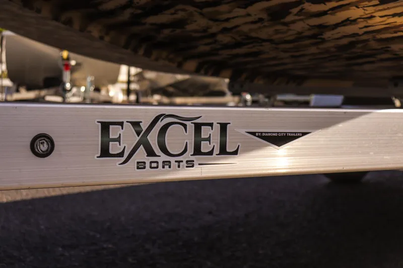 Slide: The Image of 2025 Excel 1754 F4 Shallow Water boat trailer close-up with logo. - 11
