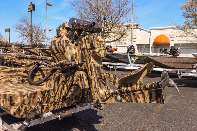 Slide: The Image of 2025 Excel 1754 F4 Shallow Water boat with camouflage design on a trailer. - 14