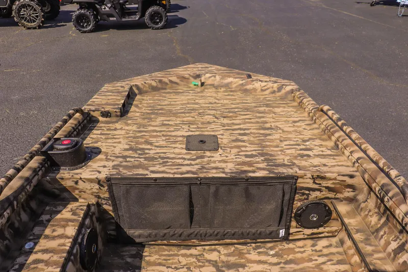 Slide: The Image of 2025 Excel 1754 F4 Shallow Water boat with camouflage design, viewed from the deck. - 15