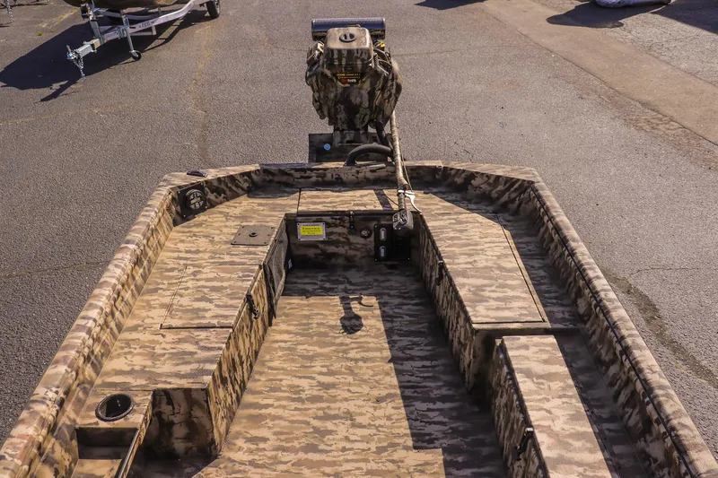 Slide: The Image of 2025 Excel 1754 F4 Shallow Water boat with camouflage design, viewed from above. - 16