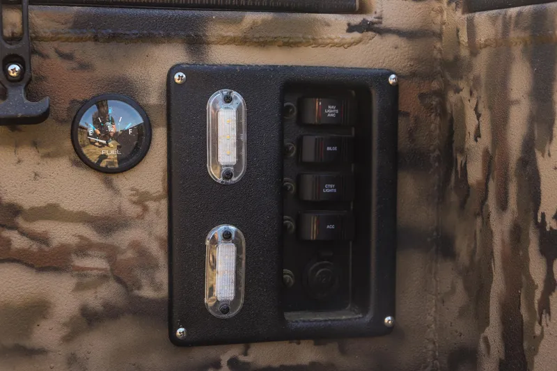 Slide: The Image of Control panel on 2025 Excel 1754 F4 Shallow Water boat, featuring switches and indicators. - 19