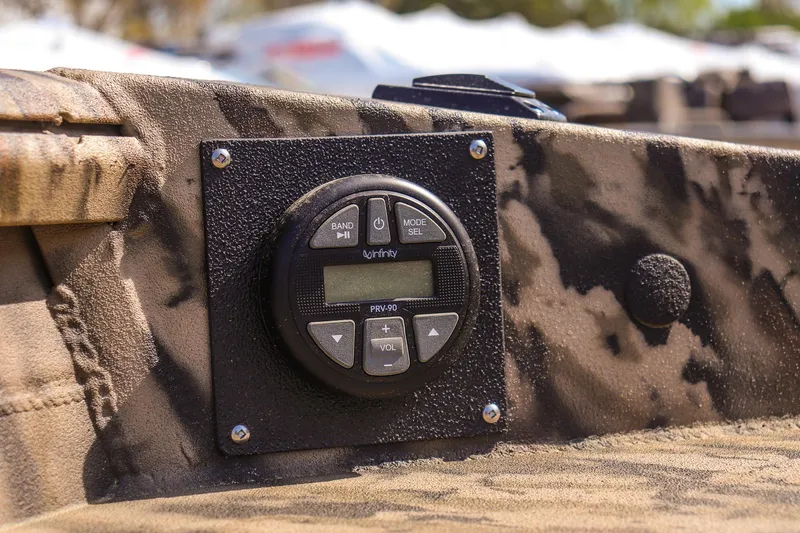 Slide: The Image of Control panel on 2025 Excel 1754 F4 Shallow Water boat, featuring camouflage design. - 20