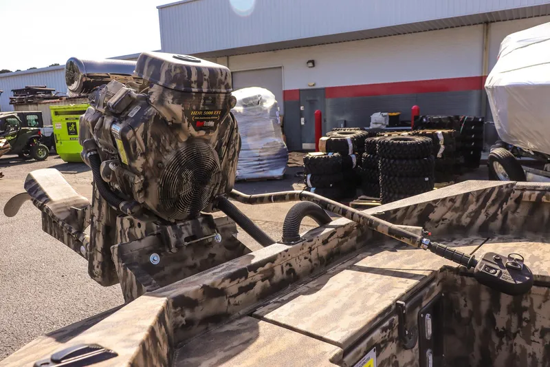 Slide: The Image of 2025 Excel 1754 F4 Shallow Water boat with camo design and powerful engine. - 22