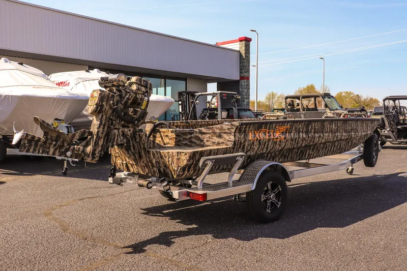 Slide: The Image of 2025 Excel 1754 F4 Shallow Water boat with camouflage design on a trailer. - 5