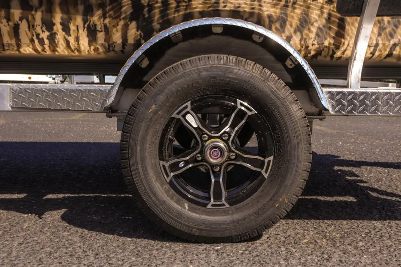 Slide: The Image of 2025 Excel 1754 F4 Shallow Water trailer wheel on asphalt road. - 9