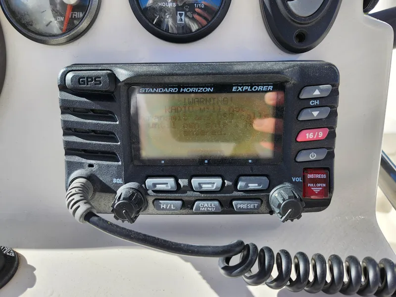 Slide: The Image of Standard Horizon Explorer GPS radio on 2018 Bayliner Element F21 boat dashboard. - 24