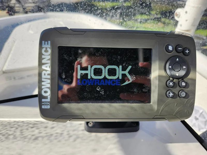 Slide: The Image of Lowrance HOOK fish finder on 2018 Bayliner Element F21 boat dashboard. - 25