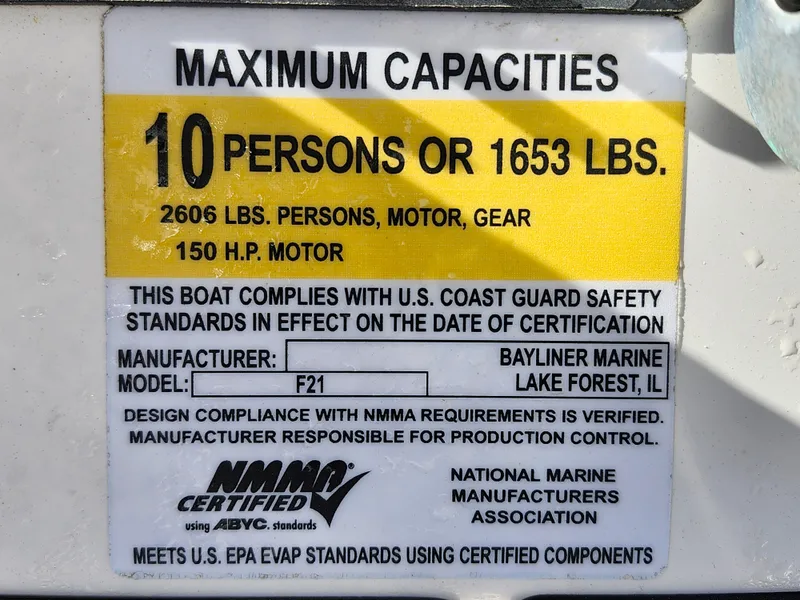 Slide: The Image of Bayliner Element F21 2018 capacity label: 10 persons or 1653 lbs, 150 HP motor. - 26
