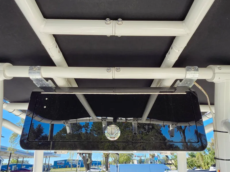 Slide: The Image of 2018 Bayliner Element F21 boat canopy and rod holder detail. - 30