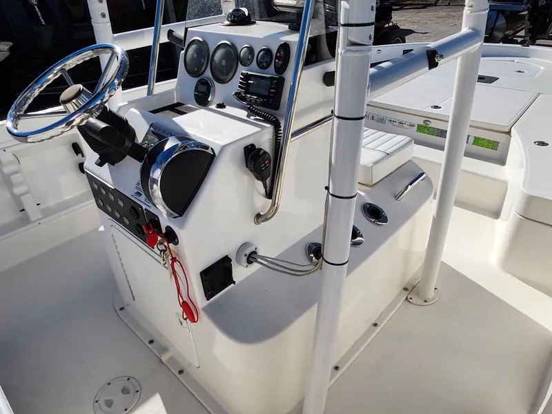 Slide: The Image of 2018 Bayliner Element F21 boat console with steering wheel and control panel. - 33