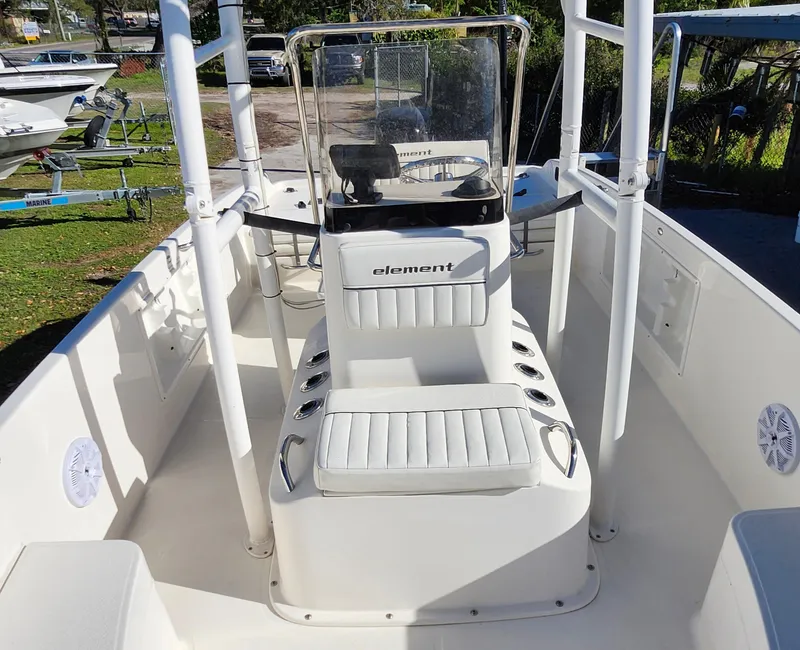 Slide: The Image of 2018 Bayliner Element F21 boat interior with center console and seating. - 34