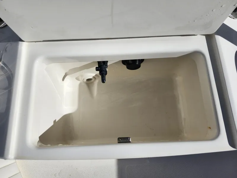 Slide: The Image of Open storage compartment on a 2018 Bayliner Element F21 boat. - 37